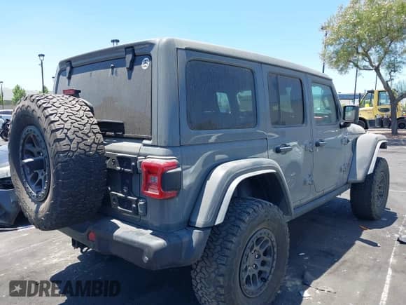 2023 Jeep Wrangler Rubicon with VIN 1C4JJXFG7PW541813, listed as a IAAI auction lot 42640045 with 53,645 mi miles and . Bid and sale history available at DreamBid. Image 4.