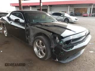 2012 Dodge Challenger R/T with VIN 2C3CDYBT7CH150005, listed as a IAAI auction lot 42809572 with 115,980 mi miles and . Bid and sale history available at DreamBid. Image 1.