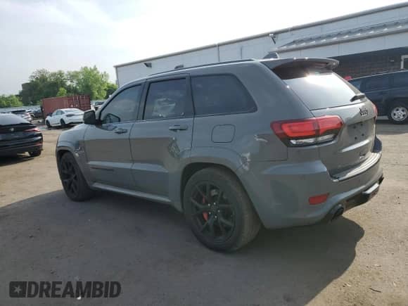 2020 Jeep Grand Cherokee SRT with VIN 1C4RJFDJ8LC158048, listed as a Copart auction lot 57426205 with 52,979 mi miles and Salvage title. Bid and sale history available at DreamBid. Image 2.