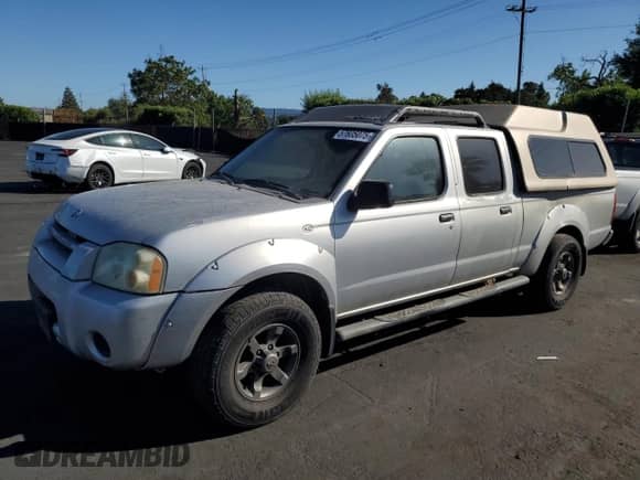 2004 Nissan Frontier XE with VIN 1N6ED29X24C429616, listed as a Copart auction lot 57605075 with 214,815 mi miles and Salvage title. Bid and sale history available at DreamBid. Image 1.