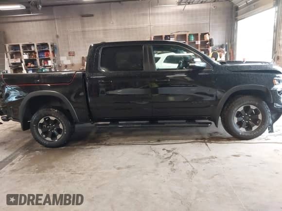 2019 Ram 1500 Rebel z VIN 1C6SRFLT2KN740072, wystawiony jako IAAI lot #43130521 z przebiegiem 94 106 mil mil oraz . Historia ofert i sprzedaży dostępna na DreamBid. Obrazek 13.