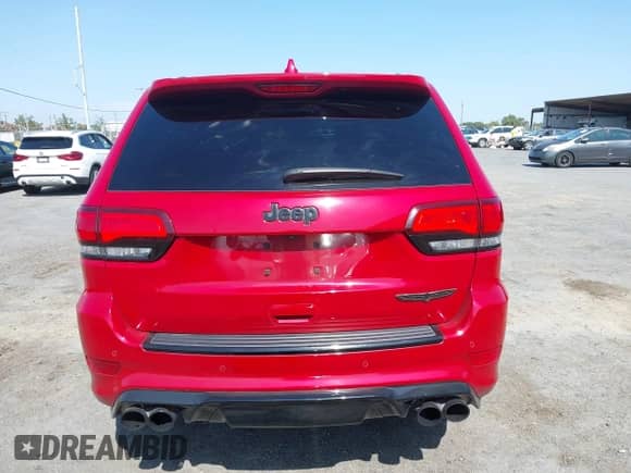 2018 Jeep Grand Cherokee Trackhawk z VIN 1C4RJFN95JC309851, wystawiony jako IAAI lot #42437320 z przebiegiem 56 504 mil mil oraz . Historia ofert i sprzedaży dostępna na DreamBid. Obrazek 16.