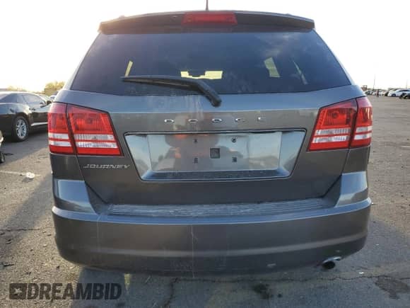 2018 Dodge Journey SE with VIN 3C4PDCABXJT375709, listed as a Copart auction lot 85906354 with 104,489 mi miles and Non repairable. Bid and sale history available at DreamBid. Image 6.