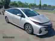 2018 Toyota Prius Plus z VIN JTDKARFP0J3075649, wystawiony jako IAAI lot #42569053 z przebiegiem 99 581 mil mil oraz . Historia ofert i sprzedaży dostępna na DreamBid. Obrazek 1.