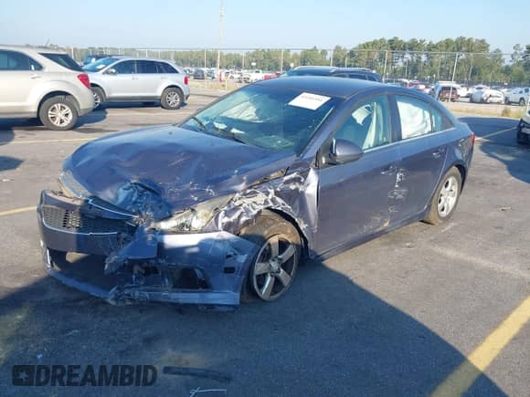 2014 Chevrolet Cruze 1LT z VIN 1G1PC5SB7E7144699, wystawiony jako IAAI lot #43241551 z przebiegiem 156 411 mil mil oraz . Historia ofert i sprzedaży dostępna na DreamBid. Obrazek 2.