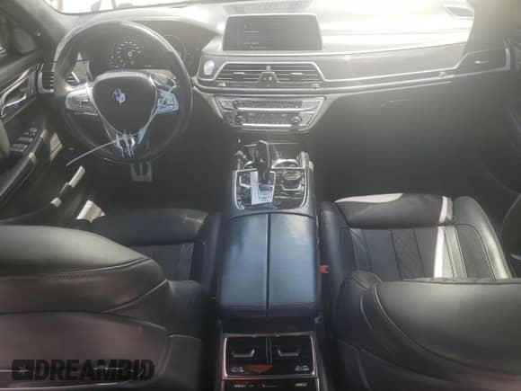2016 BMW 7 Series 750i xDrive с VIN WBA7F2C59GG417311, выставлен на аукционе Copart как лот 61777655 с пробегом 103 374 миль миль и Списание • Salvage title. История ставок и продаж доступна на DreamBid. Изображение 8.