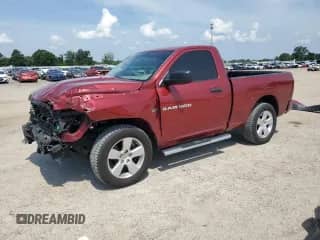 2012 Ram 1500 Express с VIN 3C6JD7AT6CG267306, выставлен на аукционе Copart как лот 62411955 с пробегом 55 313 миль миль и Списание • Salvage title. История ставок и продаж доступна на DreamBid. Изображение 1.