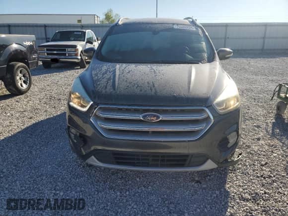 2017 Ford Escape Titanium с VIN 1FMCU0JD0HUB36440, выставлен на аукционе Copart как лот 70005225 с пробегом 130 016 миль миль и Списание • Salvage title. История ставок и продаж доступна на DreamBid. Изображение 5.