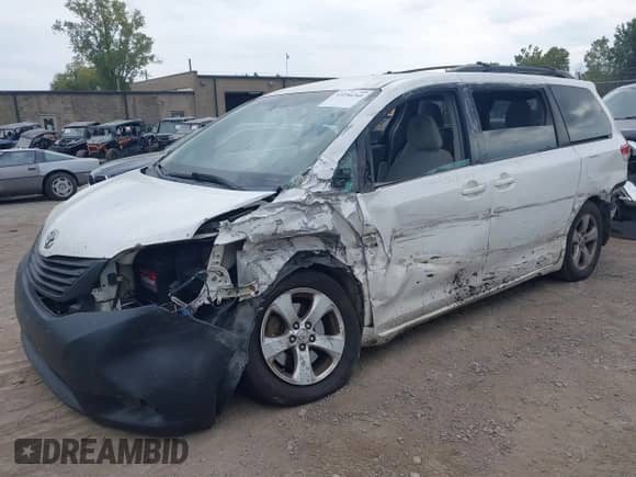 2012 Toyota Sienna LE AAS with VIN 5TDKK3DC0CS261672, listed as a IAAI auction lot 43256260 with 477,784 mi miles and . Bid and sale history available at DreamBid. Image 2.