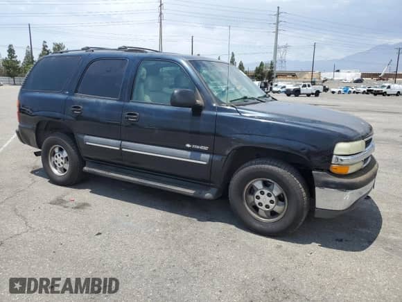 2002 Chevrolet Tahoe LS with VIN 1GNEC13T52R290024, listed as a Copart auction lot 65583635 with 154,333 mi miles and Salvage title. Bid and sale history available at DreamBid. Image 4.
