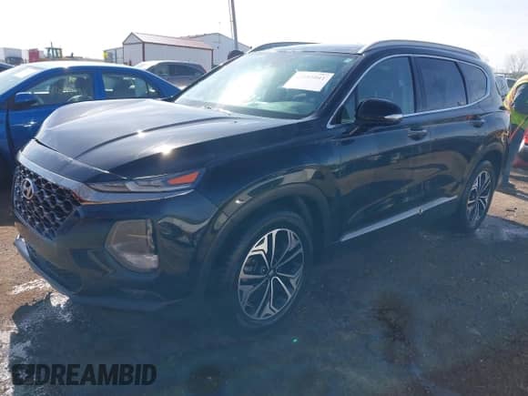 2019 Hyundai Santa Fe Ultimate с VIN 5NMS53AAXKH083541, выставлен на аукционе IAAI как лот 42081041 с пробегом 87 504 миль миль и . История ставок и продаж доступна на DreamBid. Изображение 2.