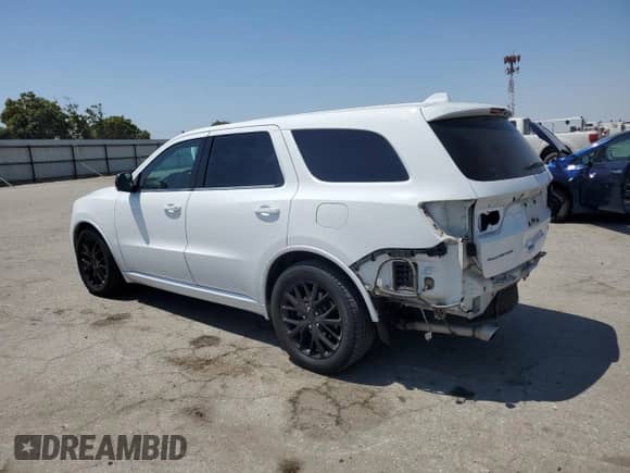2015 Dodge Durango R/T with VIN 1C4SDHCT8FC757916, listed as a Copart auction lot 64999575 with 136,876 mi miles and Salvage title. Bid and sale history available at DreamBid. Image 2.