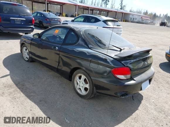 2000 Hyundai Tiburon с VIN KMHJG35F5YU191588, выставлен на аукционе IAAI как лот 41934653 с пробегом 161 590 миль миль и . История ставок и продаж доступна на DreamBid. Изображение 3.