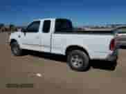 1999 Ford F-150 XL with VIN 1FTRX18L4XKB62686, listed as a Copart auction lot 84807295 with 189,359 mi miles and Salvage title. Bid and sale history available at DreamBid. Image 2.