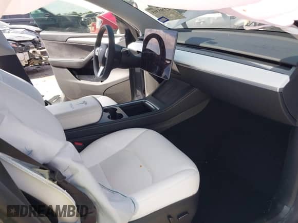 2023 Tesla Model Y Long Range with VIN 7SAYGDEE8PA163534, listed as a IAAI auction lot 42795393 with 45,172 mi miles and . Bid and sale history available at DreamBid. Image 5.