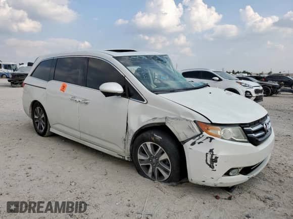 2016 Honda Odyssey Touring Elite с VIN 5FNRL5H92GB031504, выставлен на аукционе Copart как лот 81587965 с пробегом Не указан миль и Списание • Salvage title. История ставок и продаж доступна на DreamBid. Изображение 4.