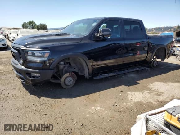 2019 Ram 1500 Rebel z VIN 1C6SRFLT9KN584502, wystawiony jako Copart lot #63851785 z przebiegiem 20 157 mil mil oraz Szkoda całkowita • Salvage title. Historia ofert i sprzedaży dostępna na DreamBid. Obrazek 1.