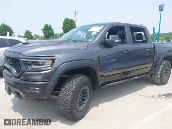 2021 Ram 1500 TRX with VIN 1C6SRFU99MN830292, listed as a IAAI auction lot 42449971 with 48,931 mi miles and . Bid and sale history available at DreamBid. Image 19.