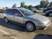 1997 Saturn SW with VIN 1G8ZK8279VZ169005, listed as a Copart auction lot 73049694 with 110,215 mi miles and Salvage title. Bid and sale history available at DreamBid. Image 4.