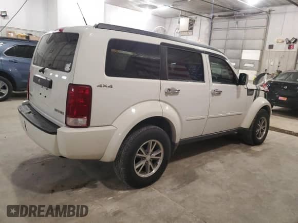 2009 Dodge Nitro SXT with VIN 1D8GU28K19W544135, listed as a Copart auction lot 84706354 with 98,925 mi miles and Salvage title. Bid and sale history available at DreamBid. Image 3.