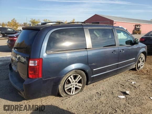 2009 Dodge Caravan with VIN 2D8HN44X39R672674, listed as a Copart auction lot 73094654 with 205,972 mi miles and Salvage title. Bid and sale history available at DreamBid. Image 3.