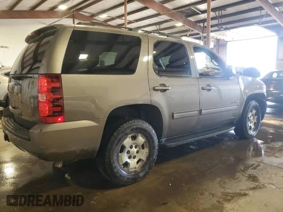 2012 Chevrolet Tahoe LS with VIN 1GNSKAE06CR227928, listed as a Copart auction lot 65878915 with 117,985 mi miles and Salvage title. Bid and sale history available at DreamBid. Image 3.