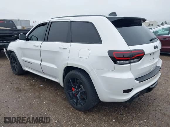 2016 Jeep Grand Cherokee SRT with VIN 1C4RJFDJ0GC456325, listed as a IAAI auction lot 41425211 with 159,746 mi miles and . Bid and sale history available at DreamBid. Image 3.