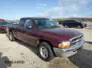 2000 Dodge Dakota Sport с VIN 1B7GL22NXYS695274, выставлен на аукционе Copart как лот 52212485 с пробегом 105 592 миль миль и Списание • Salvage title. История ставок и продаж доступна на DreamBid. Изображение 4.