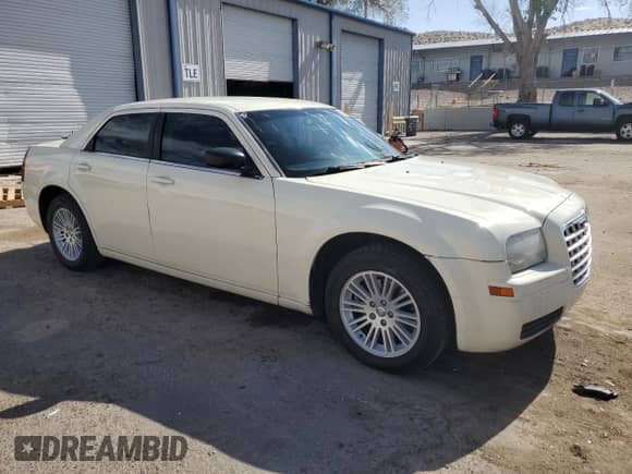 2009 Chrysler 300 LX with VIN 2C3KA43D49H577686, listed as a Copart auction lot 53002035 with 239,337 mi miles and Salvage title. Bid and sale history available at DreamBid. Image 4.