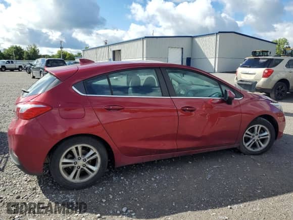 2018 Chevrolet Cruze LT with VIN 3G1BE6SM7JS557990, listed as a Copart auction lot 70334195 with 210,334 mi miles and Salvage title. Bid and sale history available at DreamBid. Image 3.