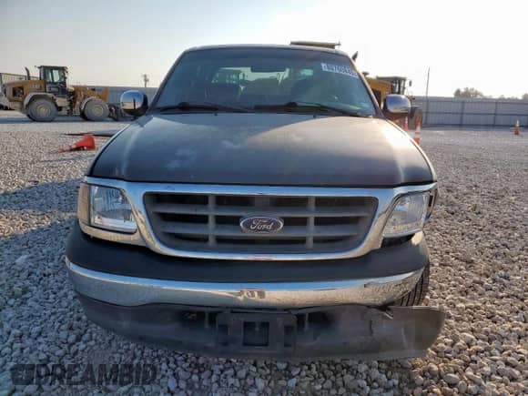 2002 Ford F-150 XLT с VIN 1FTRW07L12KC05808, выставлен на аукционе Copart как лот 80760845 с пробегом 258 794 миль миль и Списание • Salvage title. История ставок и продаж доступна на DreamBid. Изображение 5.