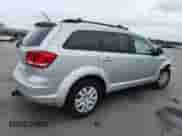 2014 Dodge Journey SE with VIN 3C4PDDAG0ET284651, listed as a Copart auction lot 64187145 with 182,485 mi miles and Salvage title. Bid and sale history available at DreamBid. Image 3.