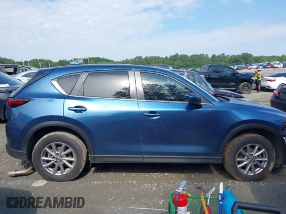 2023 Mazda CX-5 S Preferred z VIN JM3KFBCM3P0255230, wystawiony jako IAAI lot #42420823 z przebiegiem 69 331 mil mil oraz . Historia ofert i sprzedaży dostępna na DreamBid. Obrazek 13.