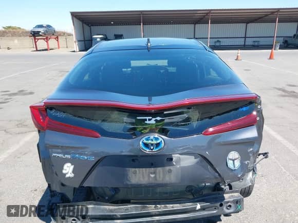 2018 Toyota Prius Plus z VIN JTDKARFP3J3073801, wystawiony jako IAAI lot #42903373 z przebiegiem 90 429 mil mil oraz . Historia ofert i sprzedaży dostępna na DreamBid. Obrazek 17.