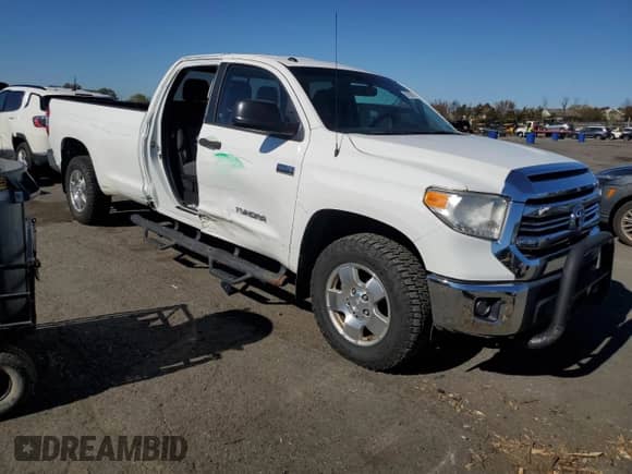 2016 Toyota Tundra SR with VIN 5TFCY5F1XGX020292, listed as a Copart auction lot 87105715 with 121,822 mi miles and Salvage title. Bid and sale history available at DreamBid. Image 4.