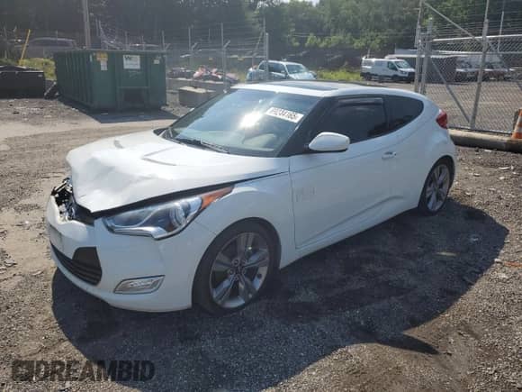 2012 Hyundai Veloster w/Red Int z VIN KMHTC6AD5CU058901, wystawiony jako Copart lot #69244165 z przebiegiem 97 260 mil mil oraz Szkoda całkowita • Salvage title. Historia ofert i sprzedaży dostępna na DreamBid. Obrazek 1.