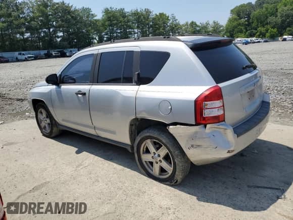 2007 Jeep Compass Sport with VIN 1J8FT47W87D158424, listed as a Copart auction lot 61333865 with 243,861 mi miles and Salvage title. Bid and sale history available at DreamBid. Image 2.