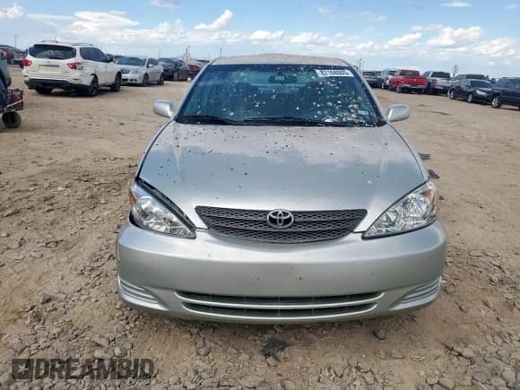 2004 Toyota Camry LE with VIN JTDBE32K740271038, listed as a Copart auction lot 82108005 with 220,896 mi miles and Salvage title. Bid and sale history available at DreamBid. Image 5.