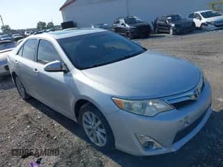 2014 Toyota Camry SE with VIN 4T1BK1FKXEU026442, listed as a IAAI auction lot 42601210 with 163,432 mi miles and . Bid and sale history available at DreamBid. Image 1.