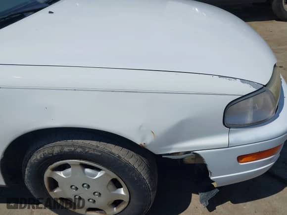 1994 Toyota Camry LE z VIN 4T1SK12C1RU432937, wystawiony jako IAAI lot #43004501 z przebiegiem 210 134 mil mil oraz . Historia ofert i sprzedaży dostępna na DreamBid. Obrazek 13.