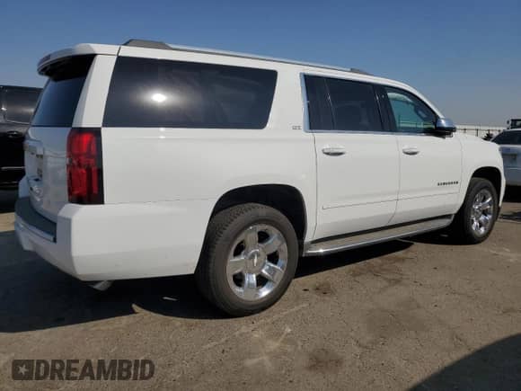 2016 Chevrolet Suburban LTZ with VIN 1GNSCJKC7GR415956, listed as a Copart auction lot 71857055 with 213,861 mi miles and Salvage title. Bid and sale history available at DreamBid. Image 3.