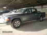 2003 Dodge Dakota Sport с VIN 1D7HL38N03S234052, выставлен на аукционе Copart как лот 44762635 с пробегом 203 591 миль миль и Списание • Salvage title. История ставок и продаж доступна на DreamBid. Изображение 1.