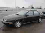 1996 Saturn SL with VIN 1G8ZK5276TZ240883, listed as a Copart auction lot 84172554 with 69,820 mi miles and Salvage title. Bid and sale history available at DreamBid. Image 1.