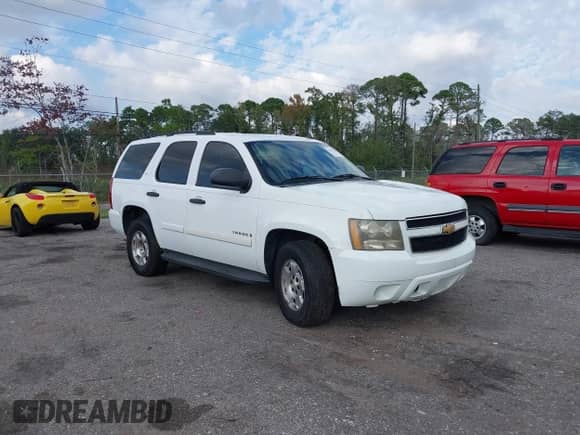 2009 Chevrolet Tahoe LS with VIN 1GNFC13C99R215860, listed as a IAAI auction lot 43342145 with 215,609 mi miles and . Bid and sale history available at DreamBid. Image 1.