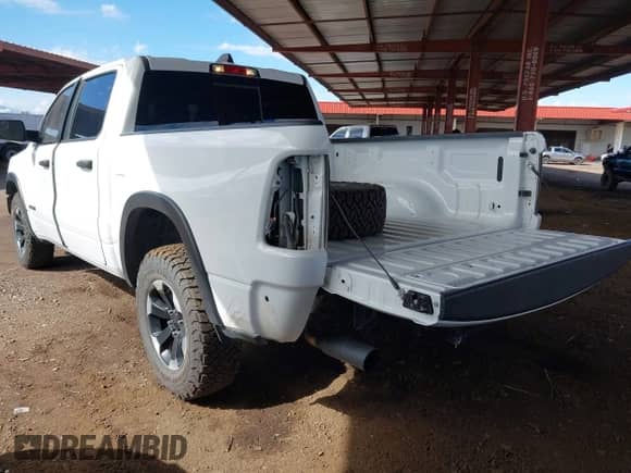 2022 Ram 1500 Rebel with VIN 1C6SRFLT3NN406752, listed as a IAAI auction lot 43346803 with 46,781 mi miles and . Bid and sale history available at DreamBid. Image 3.