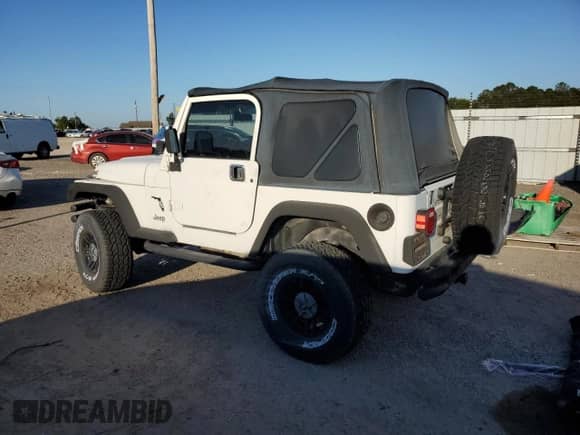 1999 Jeep Wrangler Sport with VIN 1J4FY19SXXP412760, listed as a Copart auction lot 84983895 with 180,172 mi miles and Clean title. Bid and sale history available at DreamBid. Image 2.