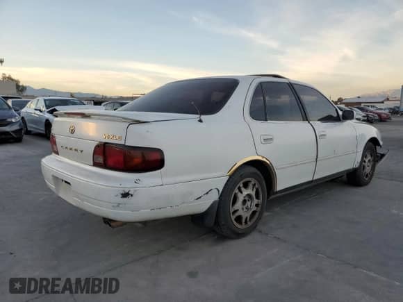 1995 Toyota Camry XLE с VIN JT2GK13E8S0123840, выставлен на аукционе Copart как лот 86379784 с пробегом 276 387 миль миль и Списание • Salvage title. История ставок и продаж доступна на DreamBid. Изображение 4.