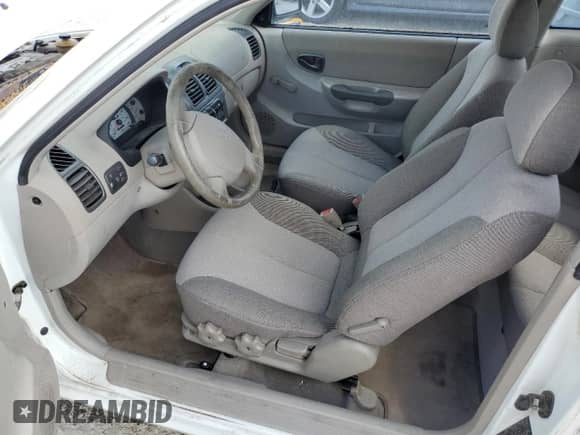 2002 Hyundai Accent GS z VIN KMHCG35C82U230535, wystawiony jako Copart lot #77709454 z przebiegiem 116 200 mil mil oraz Nie do naprawy • Non repairable. Historia ofert i sprzedaży dostępna na DreamBid. Obrazek 7.