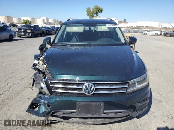 2018 Volkswagen Tiguan S с VIN 3VV1B7AX7JM108666, выставлен на аукционе Copart как лот 80034905 с пробегом 109 757 миль миль и Списание • Salvage title. История ставок и продаж доступна на DreamBid. Изображение 5.