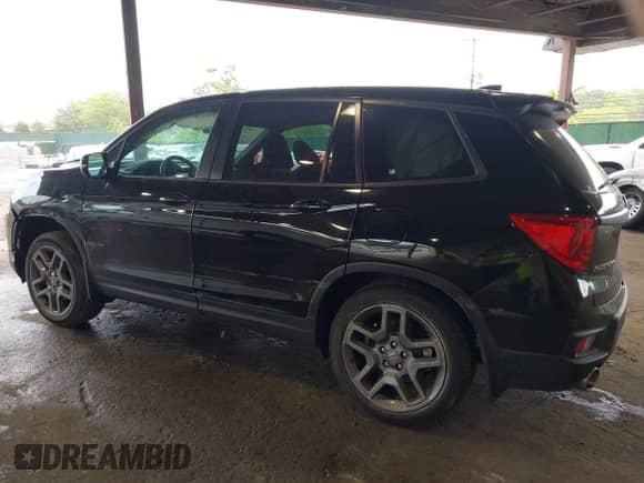 2023 Honda Passport EX-L with VIN 5FNYF8H52PB033173, listed as a IAAI auction lot 42376245 with 24,134 mi miles and . Bid and sale history available at DreamBid. Image 3.